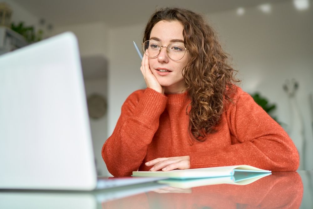 Young,Pretty,Woman,Student,Using,Laptop,Elearning,Or,Remote,Working