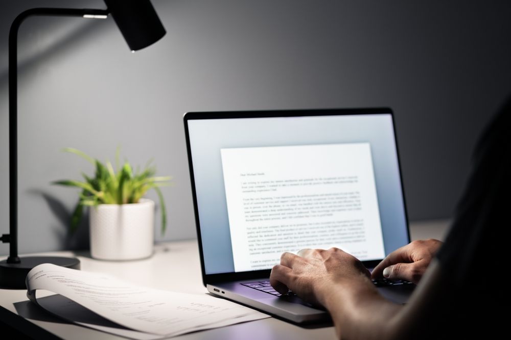 Man,Writing,Text,Document,,Essay,Or,Letter,With,Laptop.,Freelance